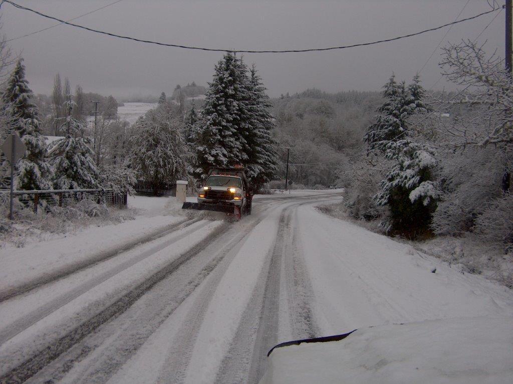 A Benton County road plows snow during a winter weather event.