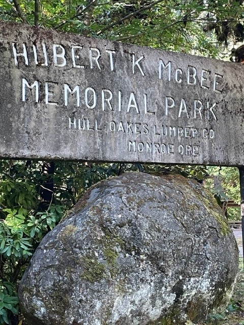 A stone memorial announces the Hubert K McBee Memorial Park to visitors.