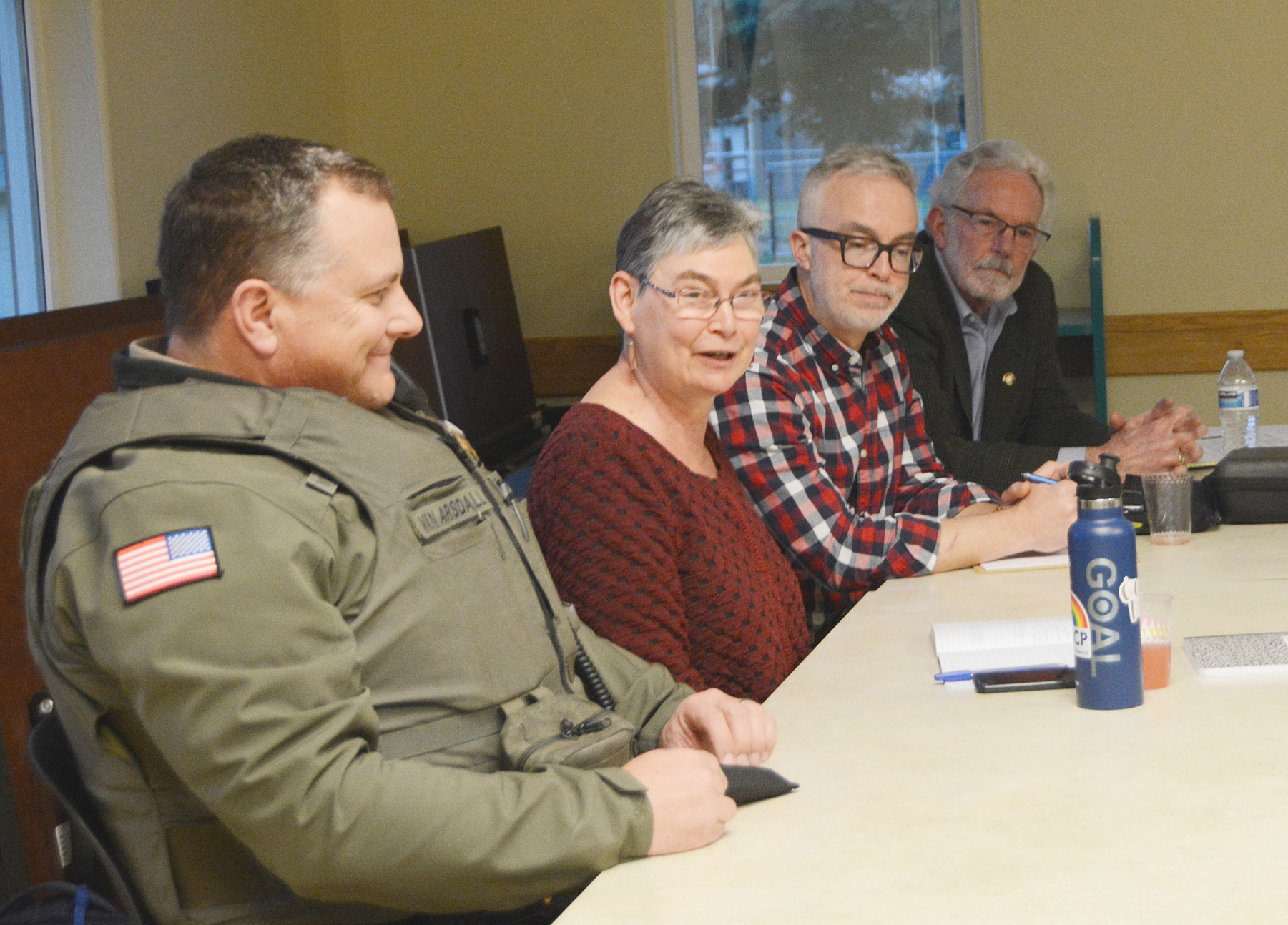 Benton County Sheriff Jef Van Arsdall, Benton County Commissioner Xan Augerot, Lincoln County Commissioner Casey Miller, and Senator Dick Anderson meet with residents of Alsea.