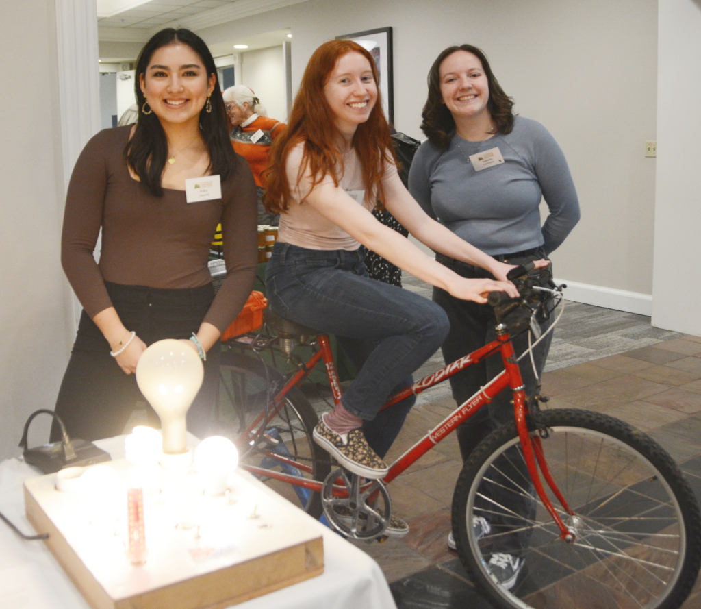 Three female Sustainability Fair hosts pose for a picture. 