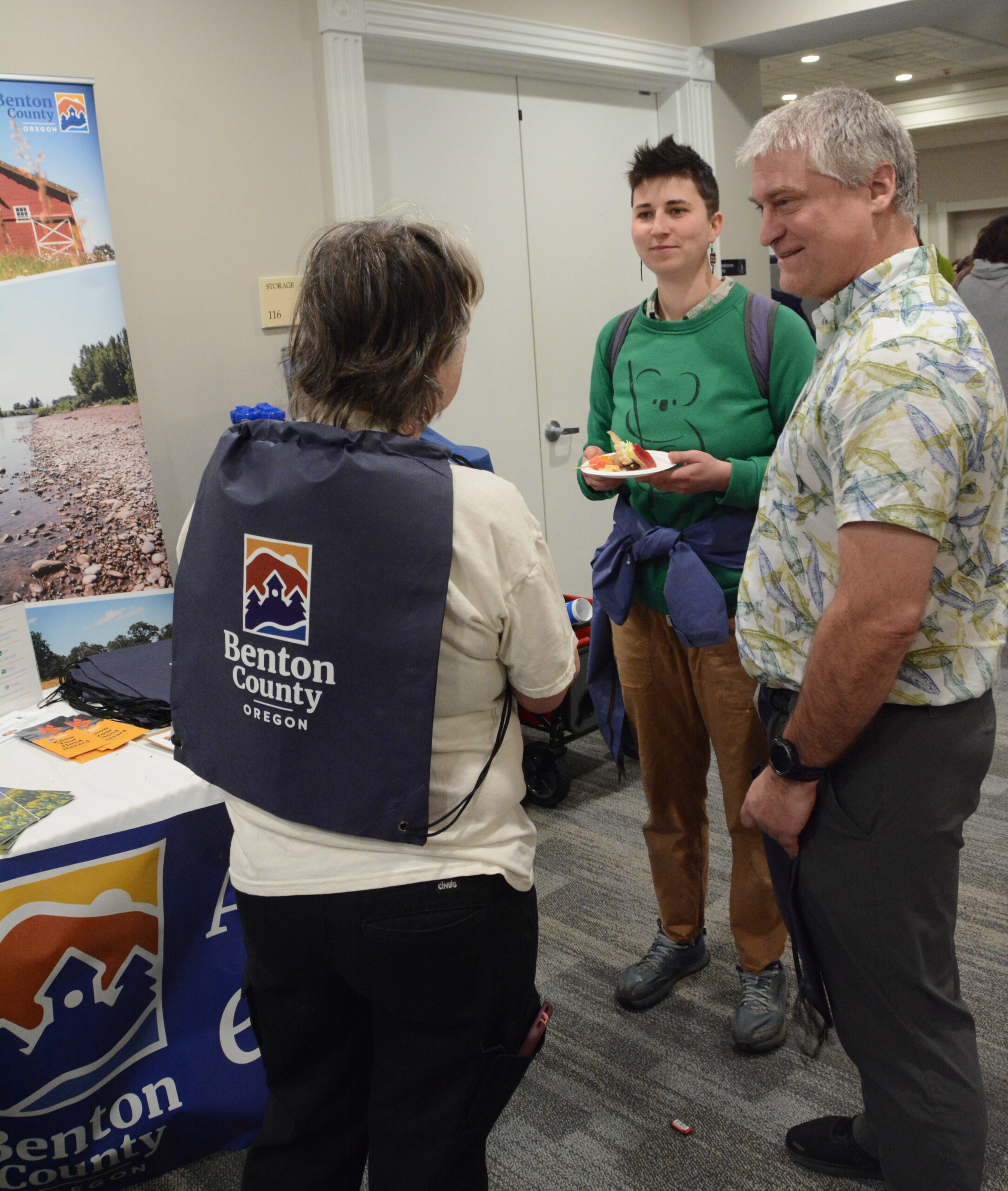 Community members stop by the Benton County table at the Sustainability Fair and speak with Community Development's Solid Waste Coordinator Bailey Payne.
