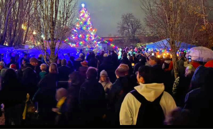 A large crowd gathers to at dusk to watch the lighting of the Christmas tree in downtown Corvallis.
