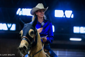 Nicole Schrock addresses the crowd from horseback during last year’s Spring Stampede at the Benton County Fairgrounds.